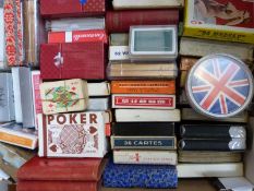 Approximately 100 packets of playing cards to include Cunard QE2, Emmanuelle transformation cards,