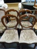 A set of four Victorian balloon-backed chairs and one other