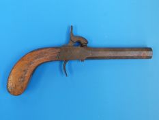 A small percussion pistol with octagonal barrel and mahogany handle