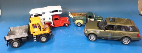 A collection of various loose diecast model vehicles