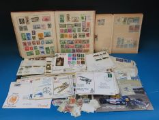 A Strand stamp album and contents with a box of loose stamps and covers