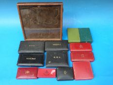 A collection of original prestigious medal boxes including DFC, MBE x 2, RRC,
