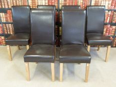 A set of six contemporary leather and light oak dining chairs