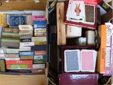 Approximately 50 packs of playing cards and other card games