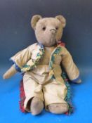 An antique Steiff bear with cocked feet and wrists, hump back,