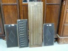 Four panels of early wood carvings