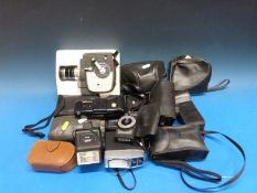 A collection of vintage cameras and equipment including a Keystone cine camera, Halina, Panasonic,