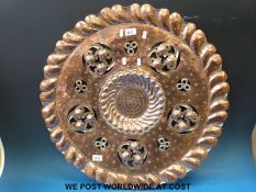 A copper Arts and Crafts charger by Emilio Casagrande,