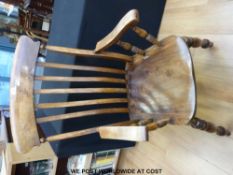 An elm seated Windsor armchair with high back