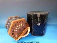 A Lachenal & Co Anglo concertina in C/G with 21 bone keys, wooden fret-worked ends,