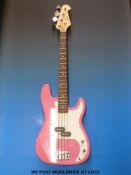 A Swift electric bass guitar in pink finish with case