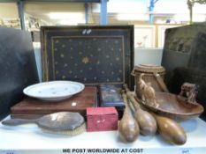 An Oriental hardwood cased set of dishes, a hallmarked silver-backed brush, juggling sticks,