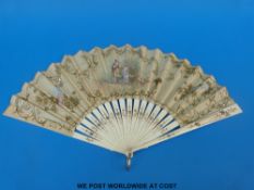 A 19thC carved bone and lace fan with with a hand-decorated scene of sweethearts in a garden,