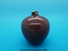 A Chinese flambe vase on bulbous form with Kangxi mark to base (7cm tall)