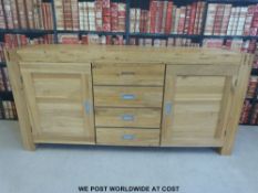 A modern oak sideboard with inset chrome handles,