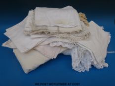 A ribboned bed cover, four Victorian tiebacks, linen, damask, tablecloths,