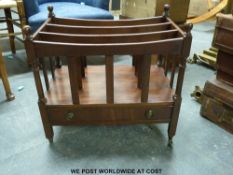 A reproduction canterbury with drawer below