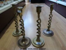Two pairs of brass hollow twist candlesticks