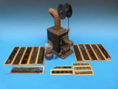A Bing cinematographic /Magic Lantern with reel mechanism and a selection of slides. Patent D.R.G.