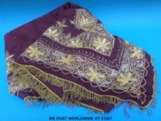 A c1900 throw with ornate gilt decoration