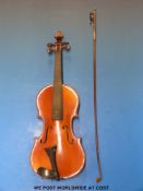 A Stradivarius copy violin and bow in case