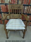 An Arts and Crafts oak elbow chair (Provenance: previously in Farnborough Baptist Church)