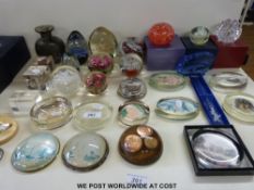 A collection of glass paperweights
