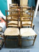 Six rush seated oak ladderback chairs in the Arts and Crafts style (5+1)