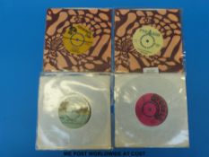 Four rare and collectable reggae 7” singles: The Techniques “You Don't Care” (Treasure Isle TI