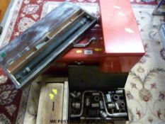 A red Stackon toolbox with tools, drill bits,