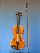 A late 19th early 20thC cased violin with 35cm flamed back,