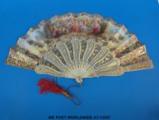 A 19thC pierced and carved bone fan elaborately decorated in gilt with birds in flight and