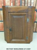 A small 19thC oak hanging corner cupboard (height 76cm)