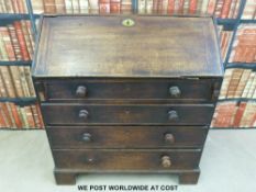 A mahogany bureau with four drawers,