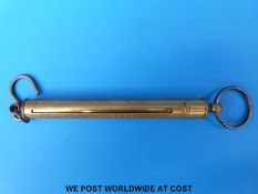 A Salter spring balance and magnifier