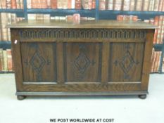 An oak blanket box with panelled front (w110 x d46 x h59cm)