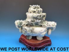 A Chinese large pale greyish-green jadeite tripod censer and cover carved with a coiled dragon