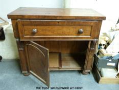 A 19thC mahogany secretaire, the opening to reveal interior,