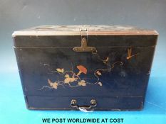 A Japanese lacquer tea caddy with gilt decoration and drawer below,