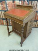 A late 19thC mahogany davenport with four drawers to one side and four false drawers to the other