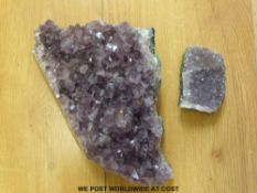 A piece of amethyst together with a smaller example