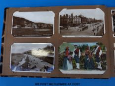 An album of postcards to include many Welsh, Barmouth, Colwyn Bay, Aberdovey, Bude, Newcastle,