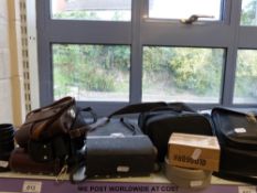 A collection of cameras including Nikon and Polaroid 635 Supercolour