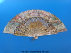 A very elaborately decorated 19thC carved, pierced and gilded mother-of-pearl fan,