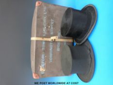 Two top hats, one silk and retailed by Woodrow, Manchester, the other collapsible by Tress & Co,