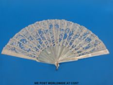 A 19thC mother-of-pearl, bone, and fine lace, fan in silk lined box,