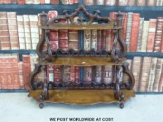 A 19thC carved mahogany three-tier whatnot or wall shelf (width 79cm)