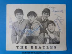 A signed Beatles postcard with signatures in pen by George, Ringo, Paul and John.