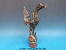 A large cast painted brass or bronze staff finial in the form of a winged dragon,