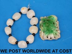 A jade bracelet and a jadeite pendant